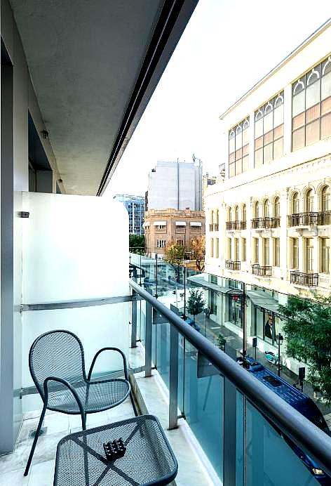 private balcony overlooking city street