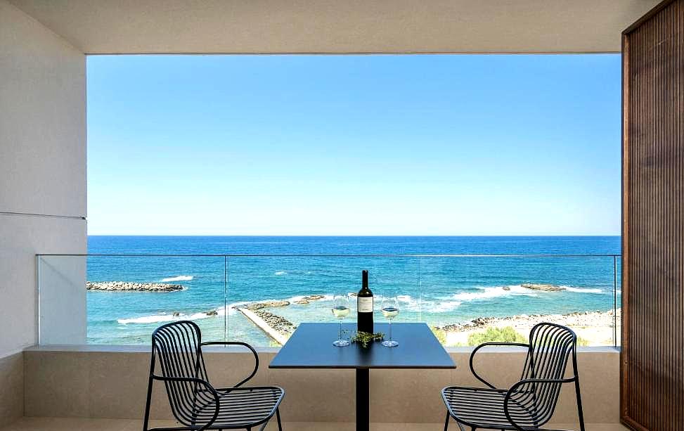 private balcony with sea view and dining table