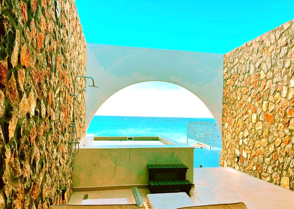 private pool area with sea view and stone walls