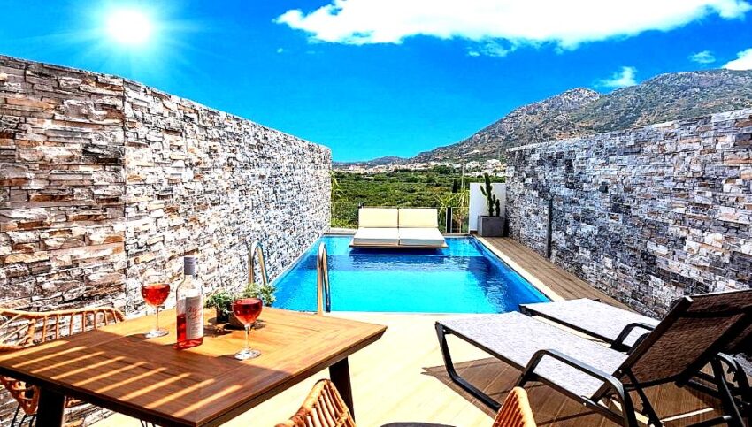 private pool terrace with mountain view and lounge chairs