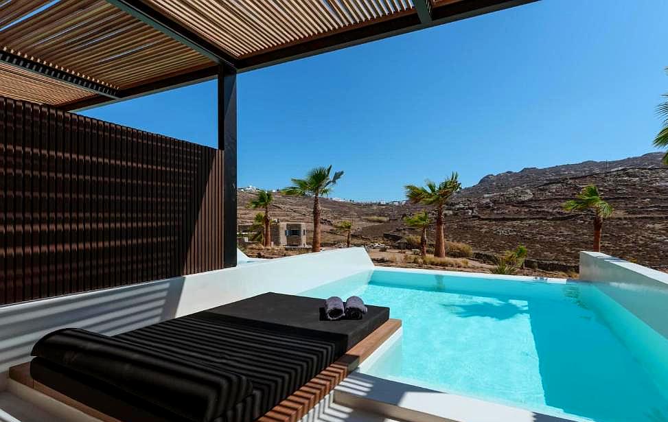 private pool with panoramic hill view and shaded lounge