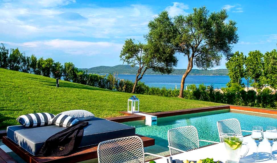 private pool with sea view and dining area