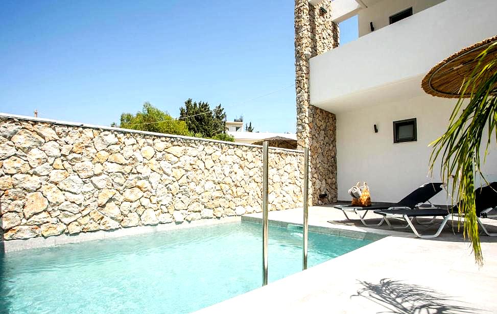 private pool with stone wall