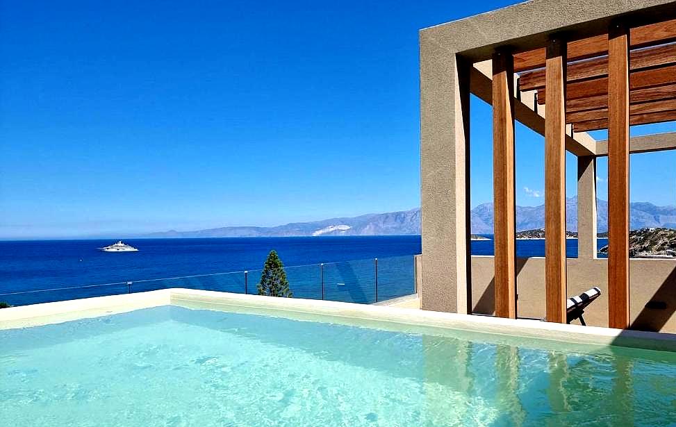 private pool with wooden pergola and sea view