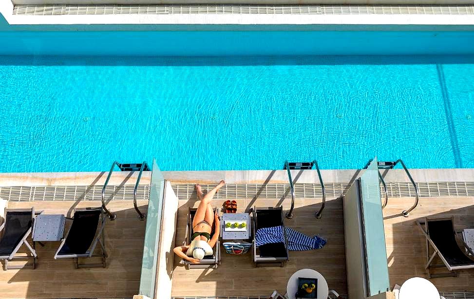 private poolside lounge with sunbeds