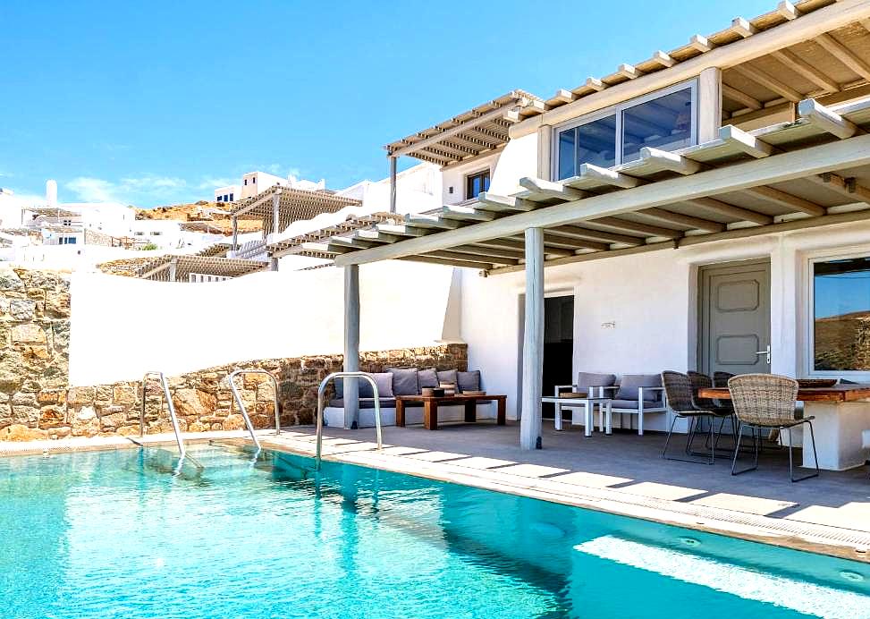 private poolside patio with modern seating and dining area