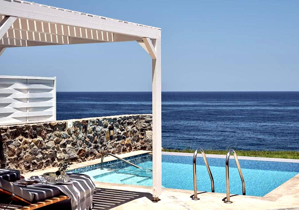 private poolside with sea view and shaded pergola