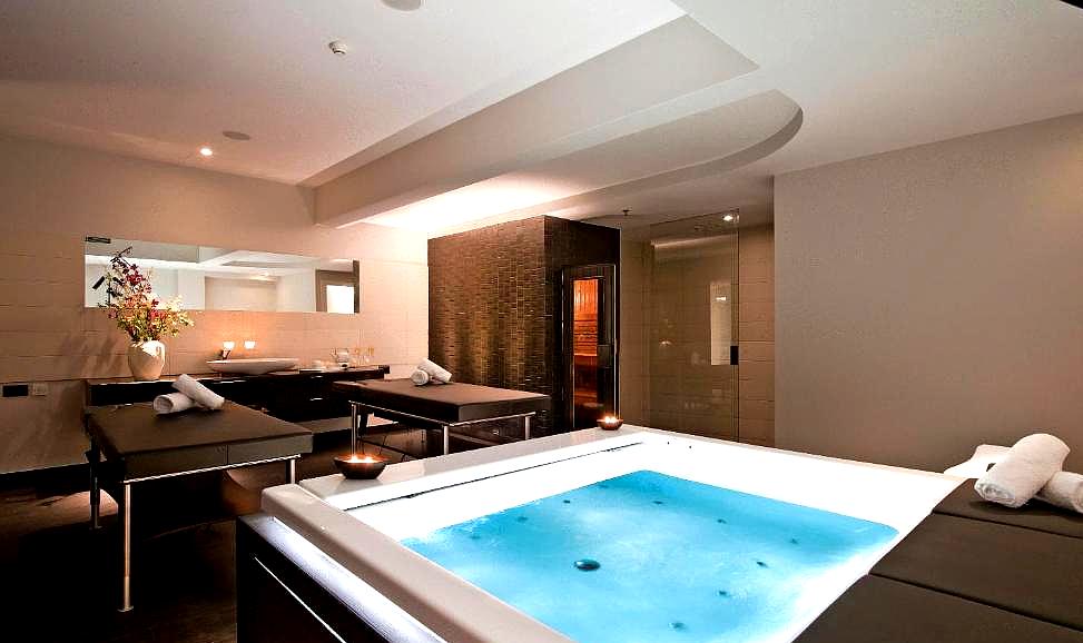 private spa room with jacuzzi and massage tables