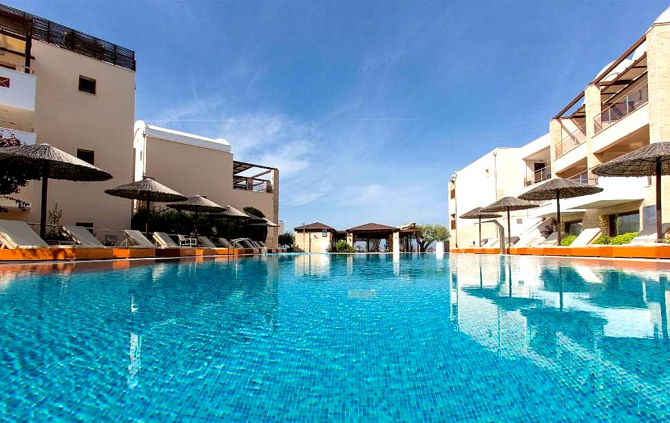 resort pool area with lounge chairs