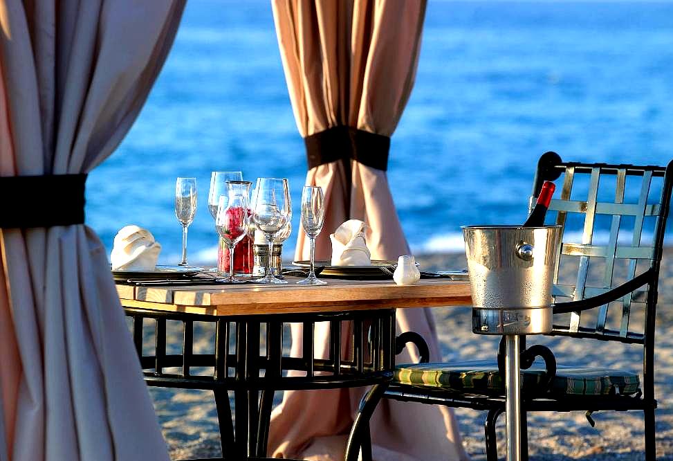 romantic beachfront dining with sea view and elegant table setting