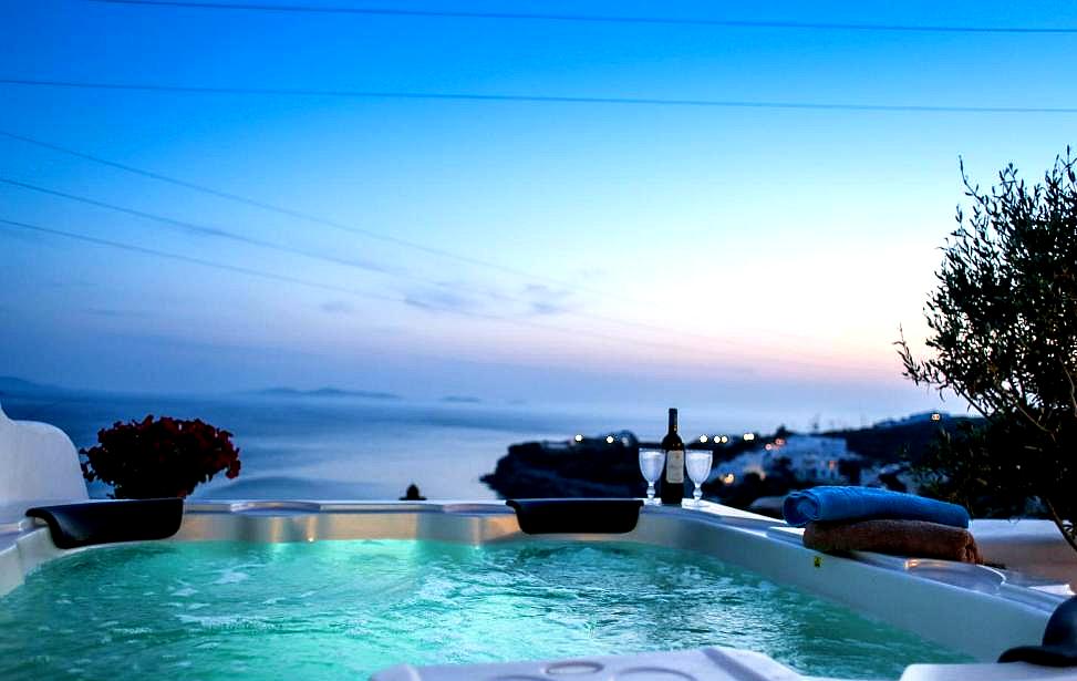 rooftop hot tub with panoramic sea view at dusk