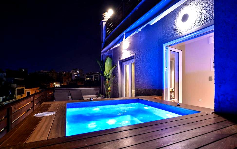 rooftop jacuzzi with night view