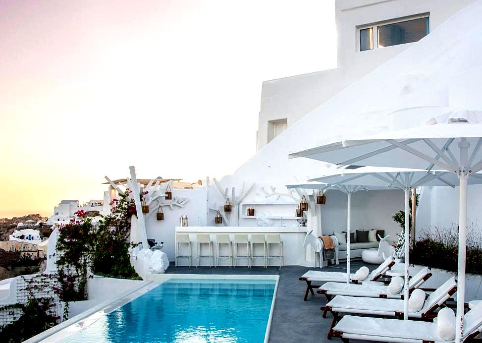 rooftop pool area with sun loungers