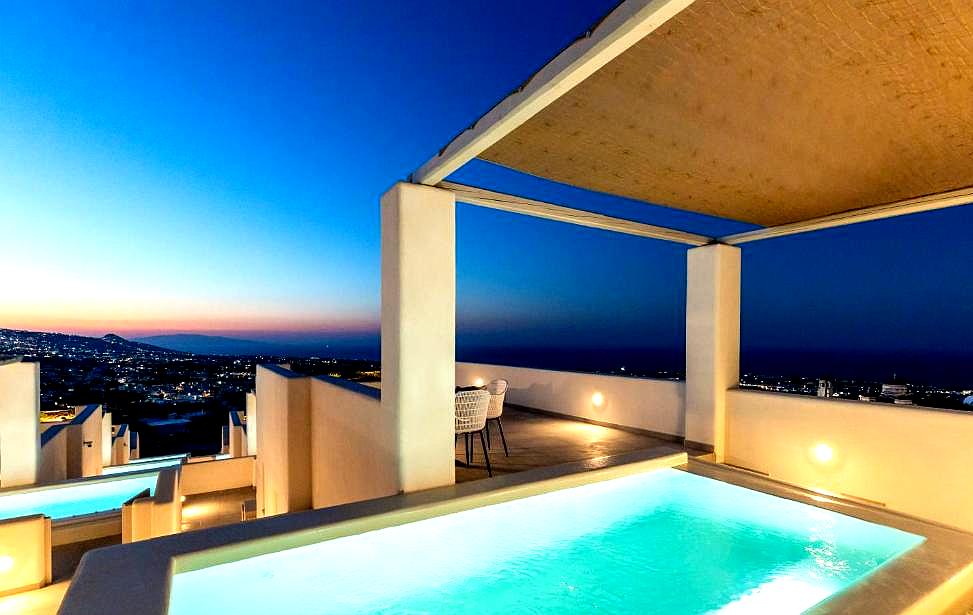 rooftop pool with panoramic sea view at dusk