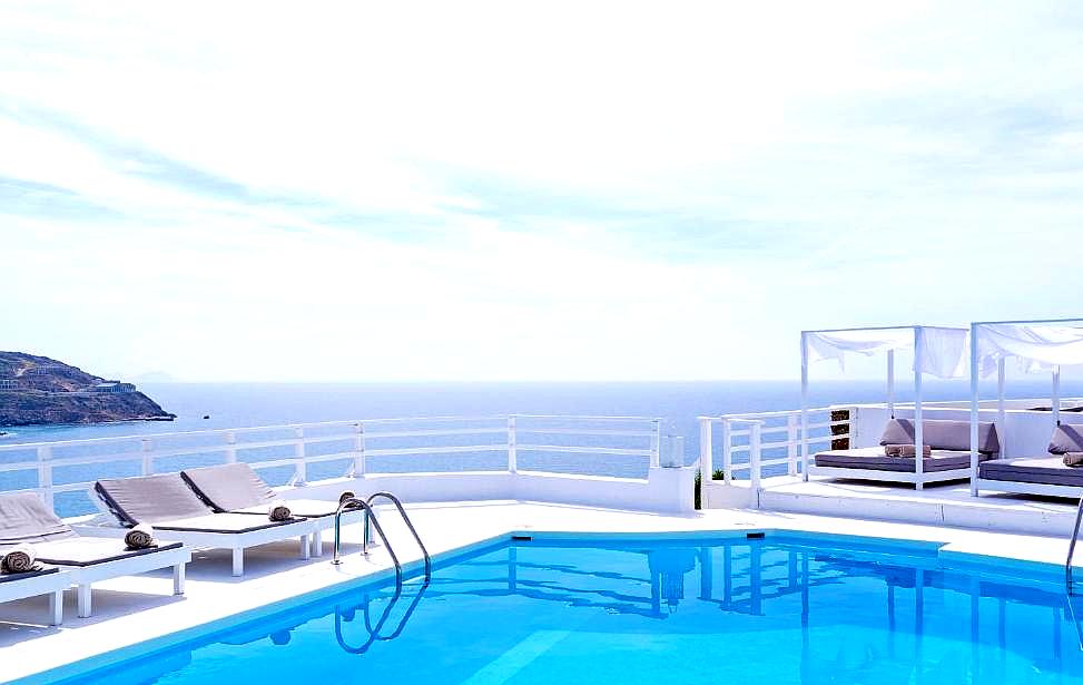 rooftop pool with sea view and sun loungers