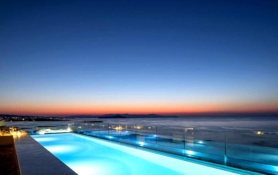 rooftop pool with stunning sea view at sunset