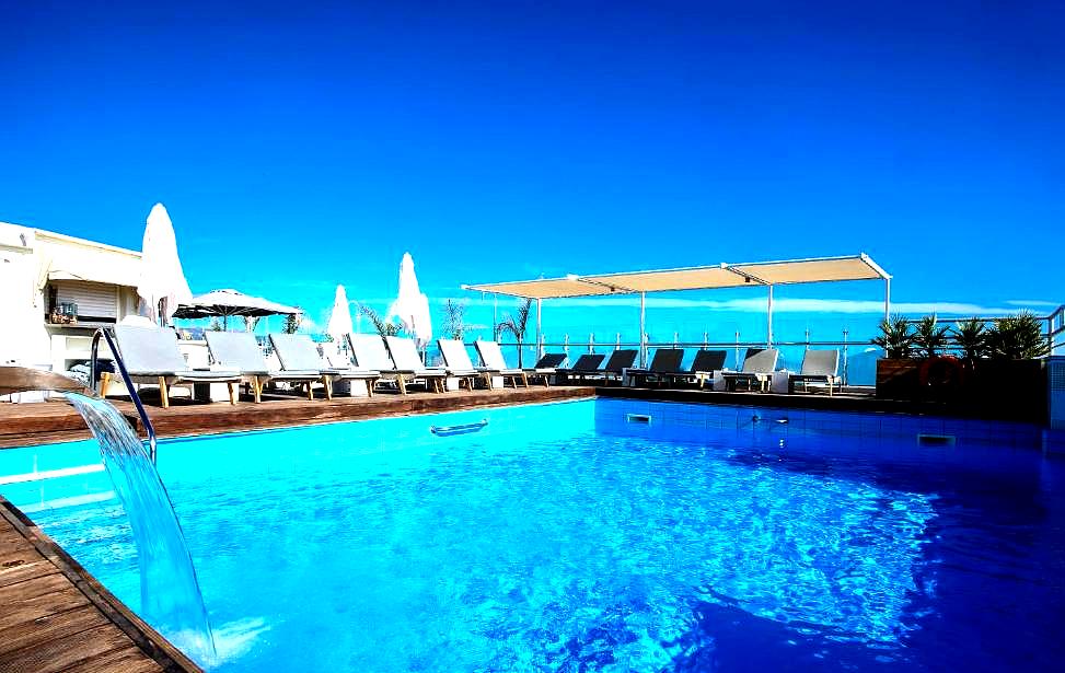 rooftop pool with sun loungers