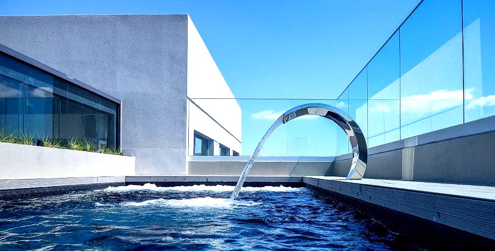 rooftop swimming pool with modern water feature