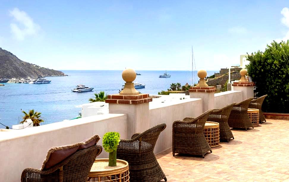 rooftop terrace with sea view lounge chairs