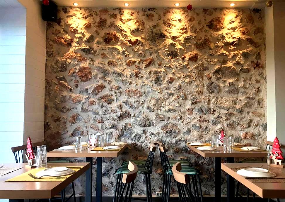 rustic restaurant with stone wall