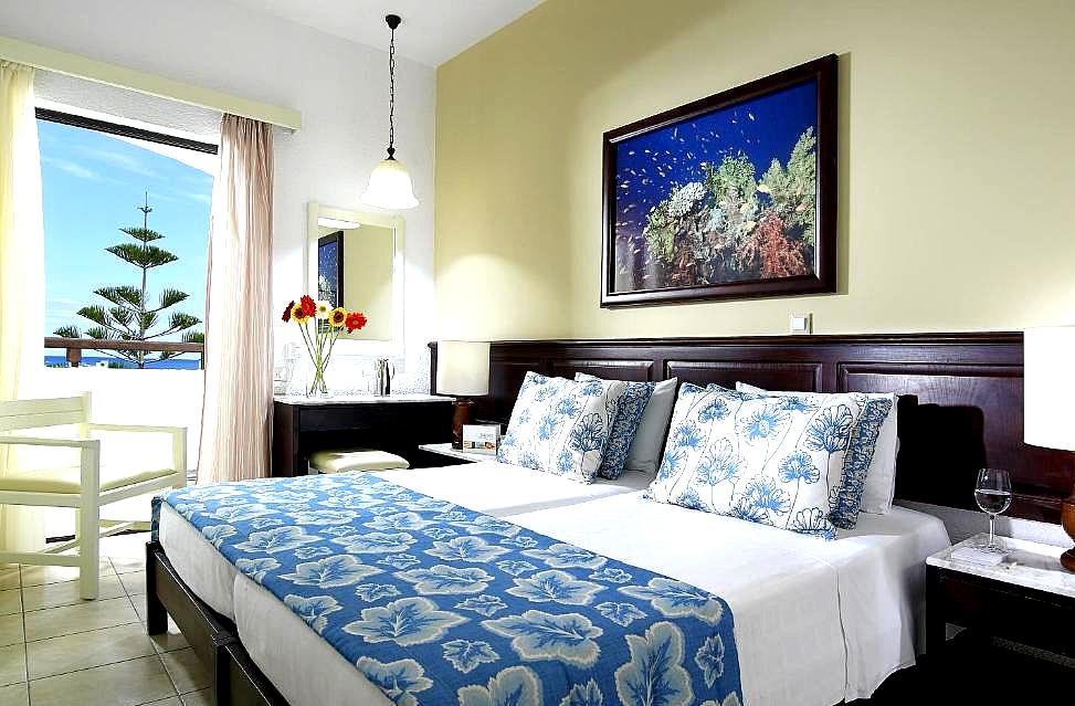 sea view room with twin beds and floral decor