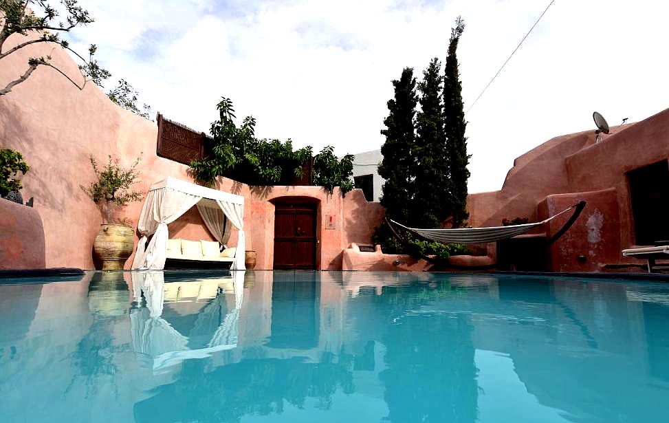 serene courtyard with pool hammock and lounge bed