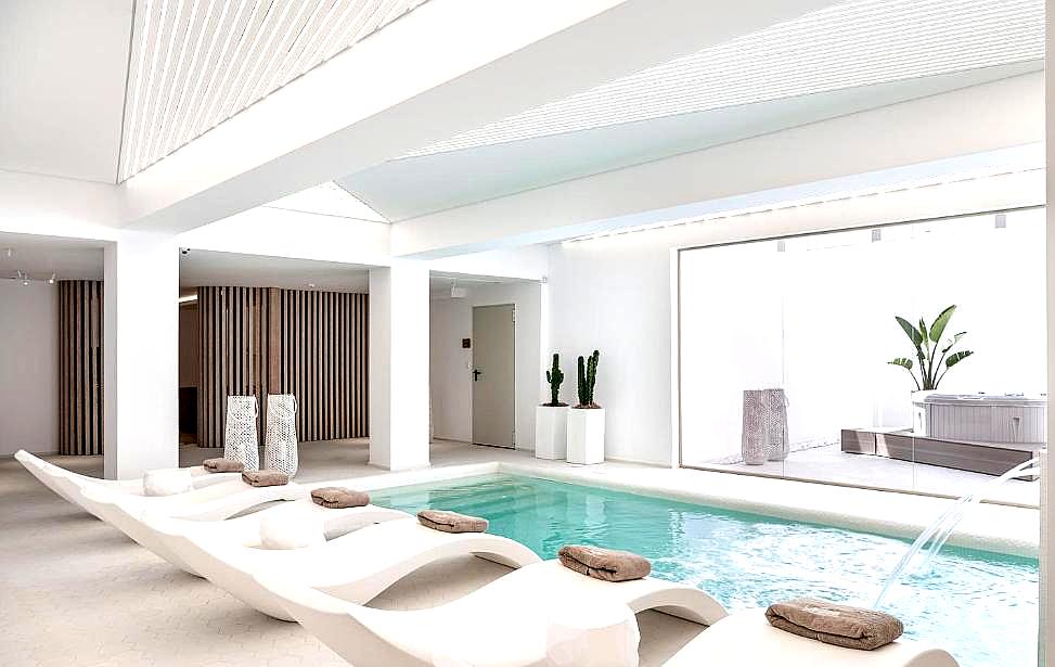 serene indoor pool with relaxation loungers