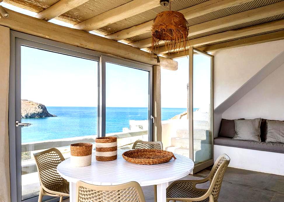 shaded outdoor seating area with breathtaking sea view