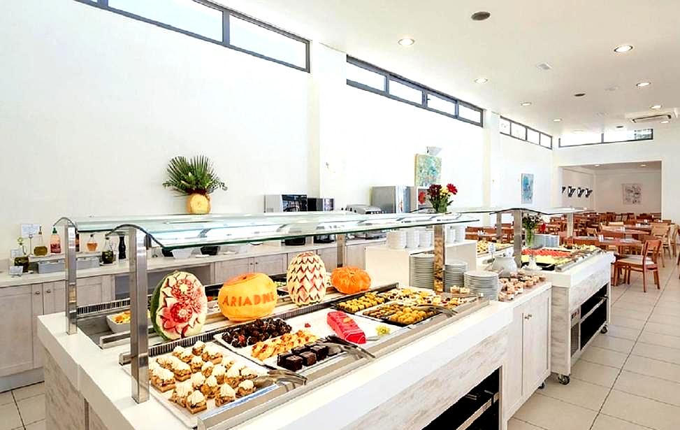 spacious hotel buffet restaurant with variety of dishes