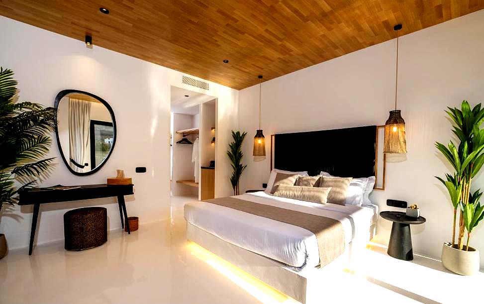 spacious modern bedroom with wooden ceiling and elegant decor