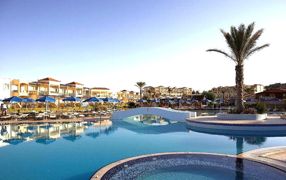 spacious pool area with palm trees