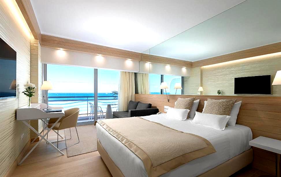 spacious room with sea view balcony and contemporary furnishings