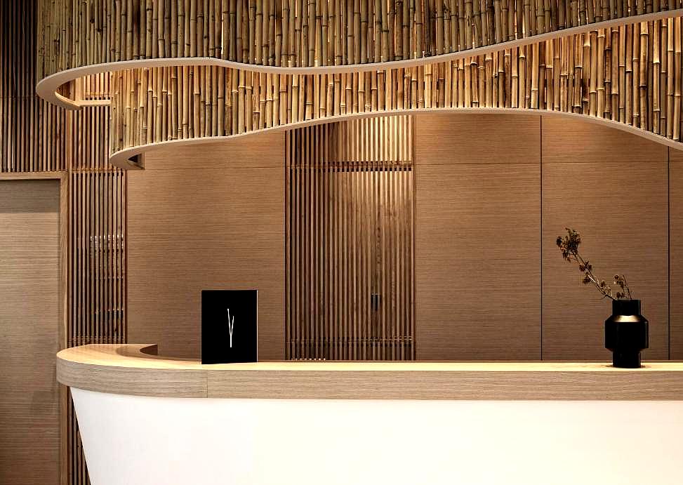 stylish bamboo accented reception desk with minimalist decor