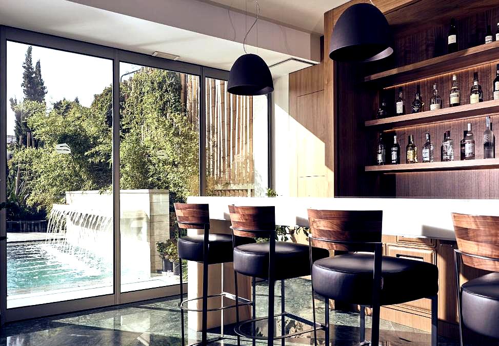 stylish bar area overlooking pool and garden