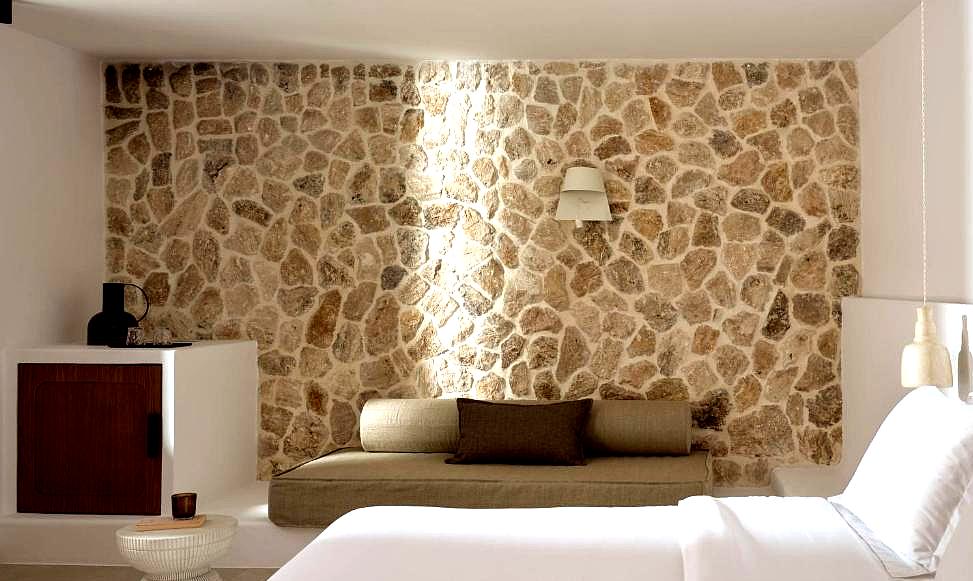 stylish room with stone accent wall and seating area