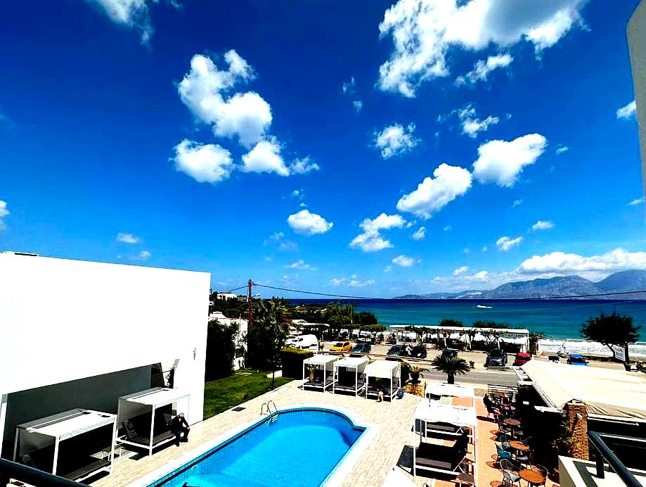 swimming pool with sea view and cabanas