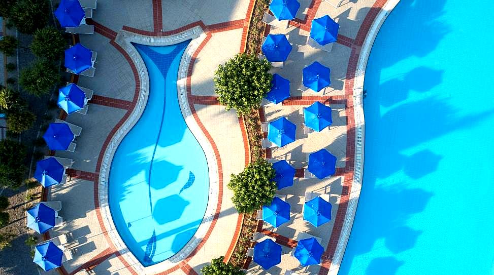 top view of pool with blue umbrellas