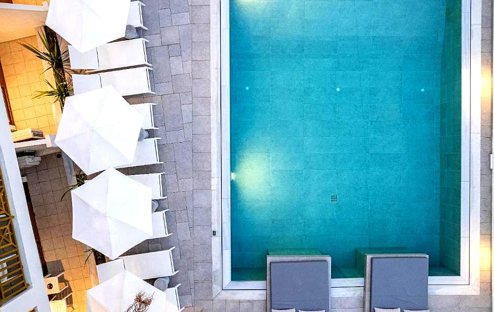 top view of poolside with lounge chairs and umbrellas