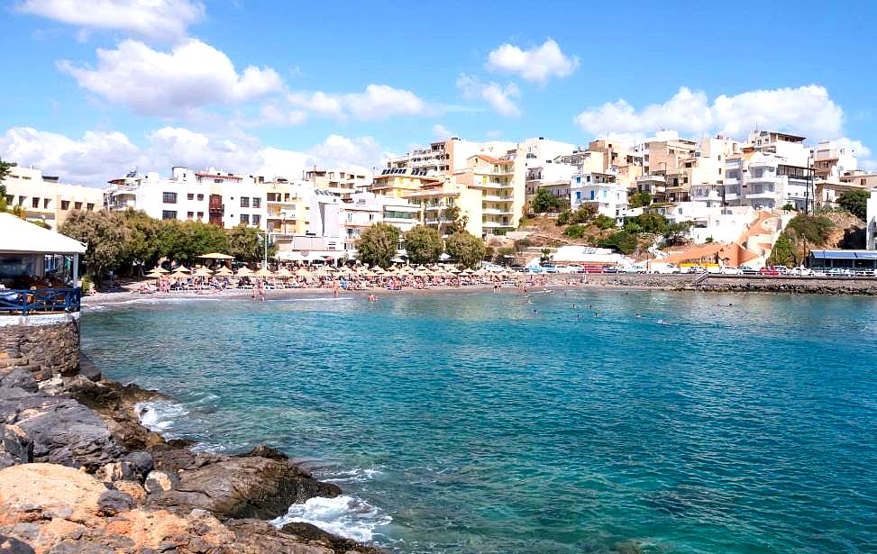 vibrant coastal town view with beach and clear water