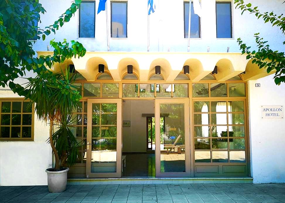 welcoming hotel entrance with arched canopy and glass doors