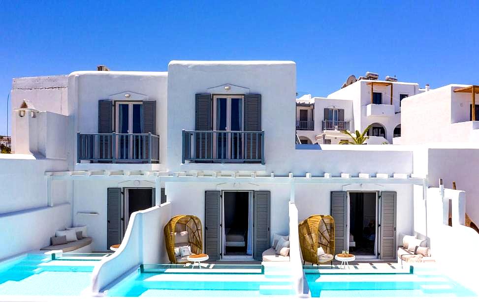 white washed villas with private pools and balconies